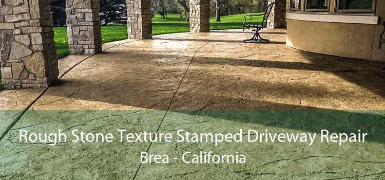 Rough Stone Texture Stamped Driveway Repair Brea - California